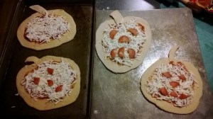 Using pepperoni shapes, the kids made their jack-o-lantern faces.