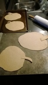 Add little stems to the pumpkin dough.