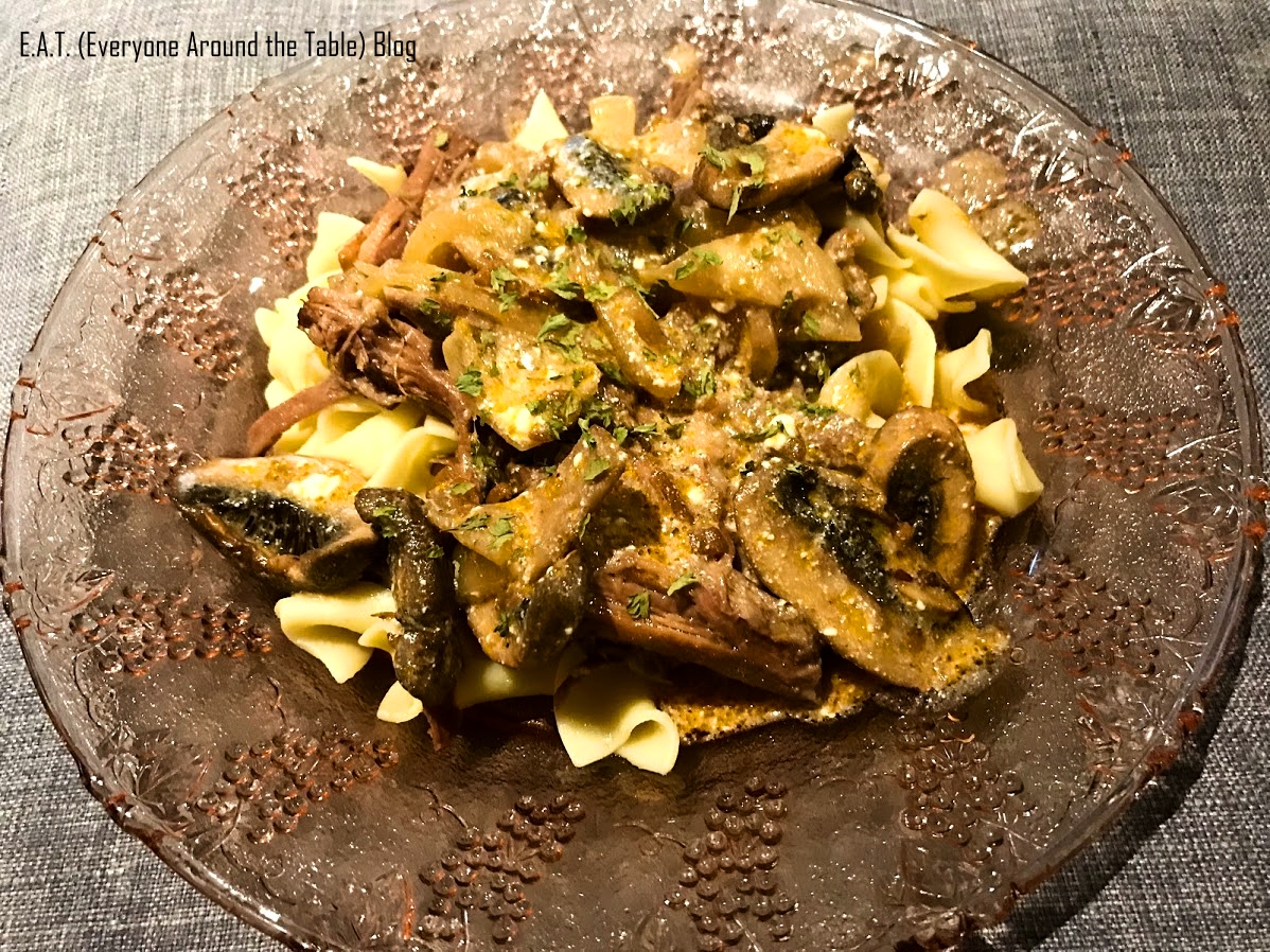 EAT - Beef and Noodles with mushroom onion sauce Served angle